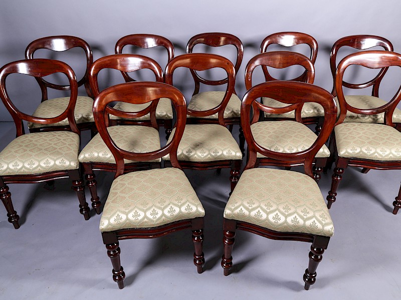 A set of 12 Victorian Mahogany Balloon Back Dining Chairs
