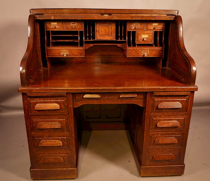 A good Oak Roll Top Desk by Maples London