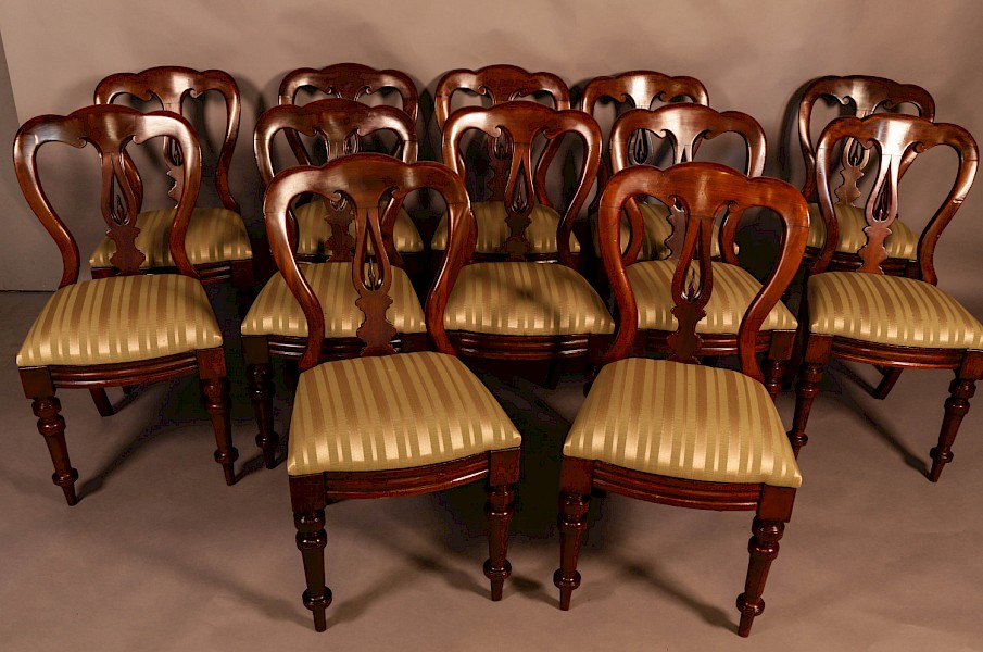 A Set of 12 Victorian Spear Point Balloon back Dining Chairs