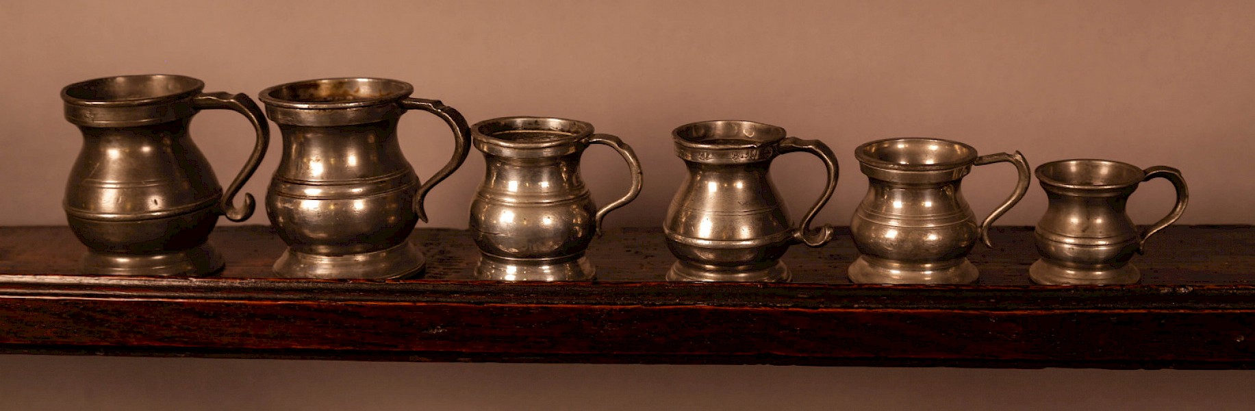 A collection of 6 pewter tankards antique