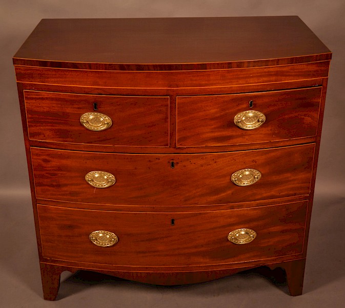 An early 19th century Bow Chest of Drawers Mahogany