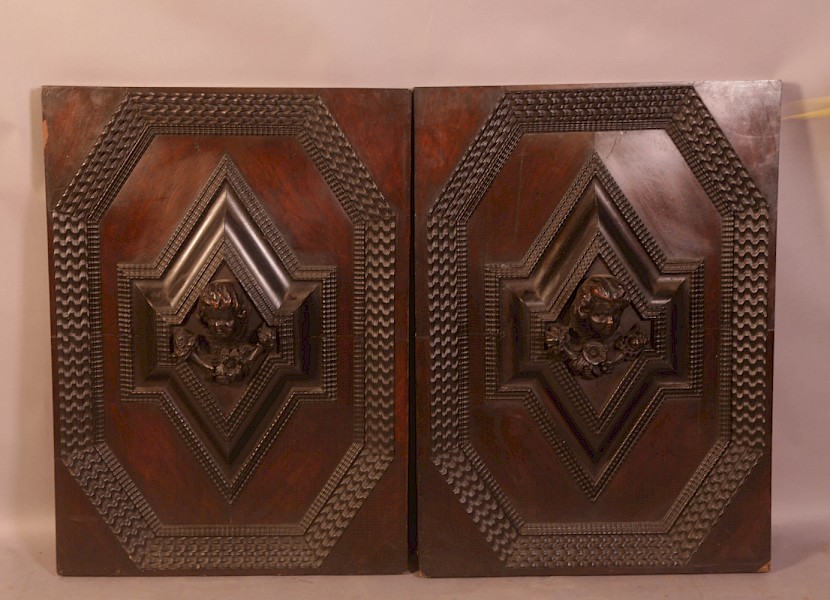 A Pair of Oak door panels carved heads