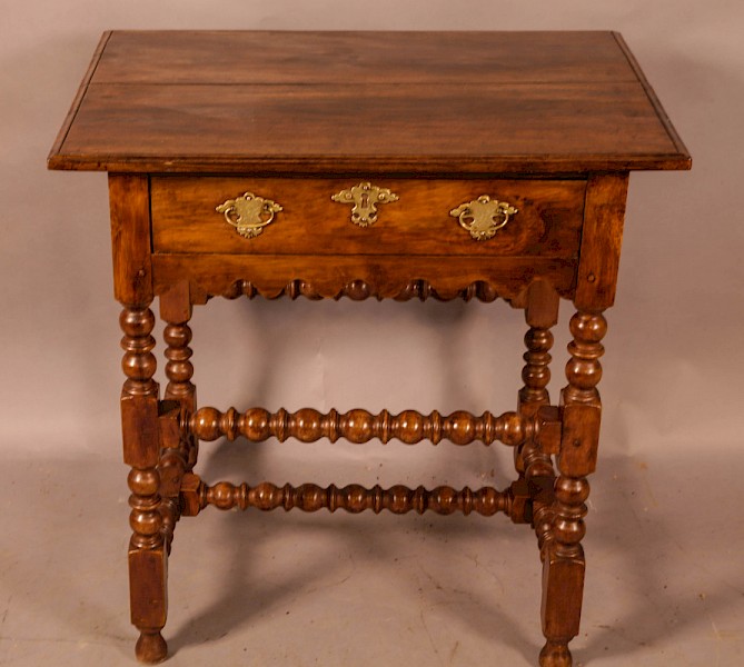 An early 18th century side table in Walnut
