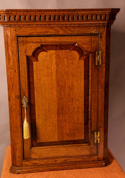 An 18th century Oak Corner Cupboard