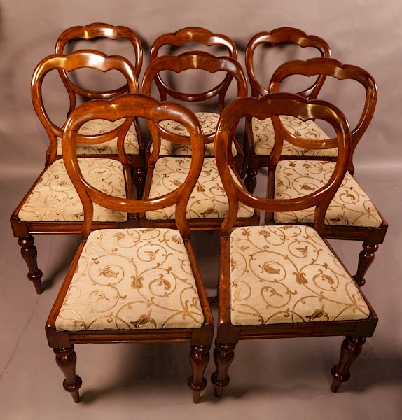 A Set of 8 Victorian Balloon Back Dining Chairs